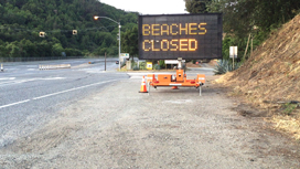 beaches closed sign